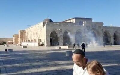 Palestinians and police clash at the Al-Aqsa Mosque as Jewish visitors tour the Temple Mount on April 21, 2022. (Screen capture: Twitter)