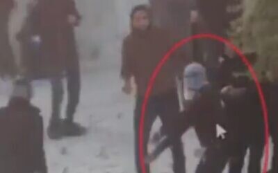 Screenshot of a clip posted by Israel's Kan TV ostensibly showing Walid a-Sharif throwing rocks on Temple Mount, on April 22, 2022. (Twitter screenshot; used in accordance with clause 27a of the Copyright law)