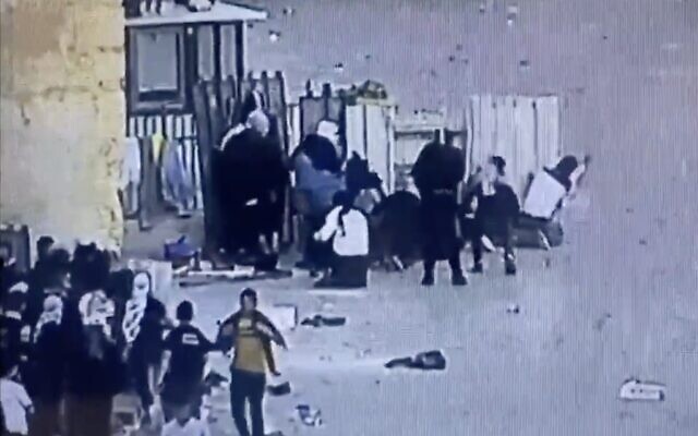 Security camera footage in a video released by police shows Palestinians clashing with officers on the Temple Mount in Jerusalem's Old City, April 29, 2022. (Screen capture: Twitter) Security camera footage in a video released by police shows Palestinians clashing with officers on the Temple Mount in Jerusalem's Old City, April 29, 2022. (Screen capture: Twitter)