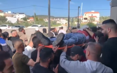 Palestinians carry the body of one of the men killed during clashes with IDF in Jenin, on April 14, 2022. (Screenshot/Twitter)