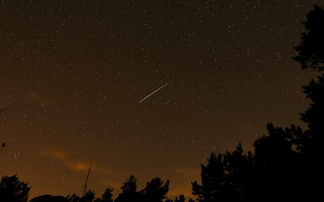 Illustrative: A meteor streaks through the sky, near Madrid, Spain, August 12, 2016. (AP Photo/Francisco Seco) Illustrative: A meteor streaks through the sky, near Madrid, Spain, August 12, 2016. (AP Photo/Francisco Seco)