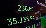 Illustrative: A screen on the floor of the New York Stock Exchange, November 29, 2021. (AP Photo/Richard Drew)