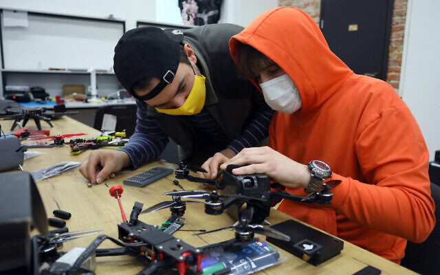 Ukrainian activists work on a drone in western Lviv, on April 1, 2022. (Aleksey Filippov/AFP) Ukrainian activists work on a drone in western Lviv, on April 1, 2022. (Aleksey Filippov/AFP)