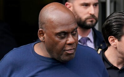 Subway shooting suspect Frank R. James, 62, is led away from a police station by law enforcement officials in New York, April 13, 2022. (AP Photo/Seth Wenig)