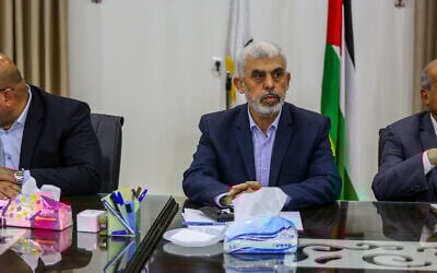 Yahya Sinwar, leader of the Hamas terror group, hosts a meeting with members of Palestinian factions, at the Hamas president's office in Gaza City, on April 13, 2022. (Attia Muhammed/Flash90)