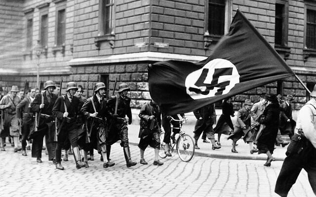 Nazi youth celebrate Adolf Hitler's takeover of Austria, in Vienna, March 12, 1938. (AP Photo)