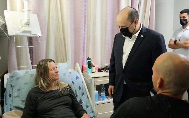 Prime Minister Naftali Bennett visits vctims from a terror shooting in Tel Aviv, at the Ichilov hospital, April 9, 2022. (Courtesy) Prime Minister Naftali Bennett visits vctims from a terror shooting in Tel Aviv, at the Ichilov hospital, April 9, 2022. (Courtesy)