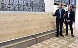 President Herzog and First Lady Michal Herzog are presented with Israel's biggest matzah at the President's House in Jerusalem, April 10, 2022. (Haim Zach/GPO)