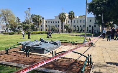 Police officers and medics at the scene of a stabbing in Haifa, April 15, 2022. (Israel Police)