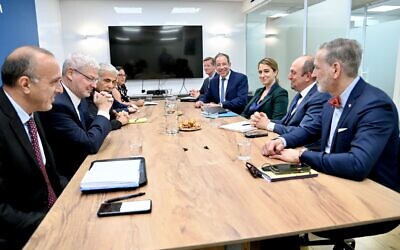 File: Foreign Minister Yair Lapid (third from L) meets with a US delegation that includes Ambassador to Israel Tom Nides (4th from right), Acting Assistant Secretary of State for Near Eastern Affairs Yael Lempert (third from right) and Deputy Assistant Secretary of State for Israeli and Palestinian Affais Hady Amr (2nd from right) in Tel Aviv, on April 21, 2022. (David Azoulay/US Embassy in Israel)