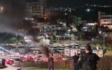 Police officers are seen during a riot at the entrance of the northern Arab city of Umm al-Fahm, early April 23, 2022. (Israel Police)