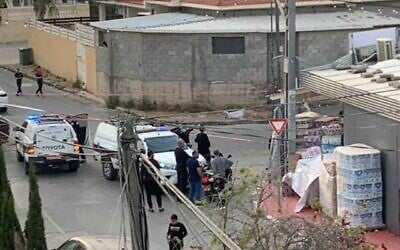 Police at the scene of a deadly shooting in Qalansawe, on April 23, 2022. (Courtesy)