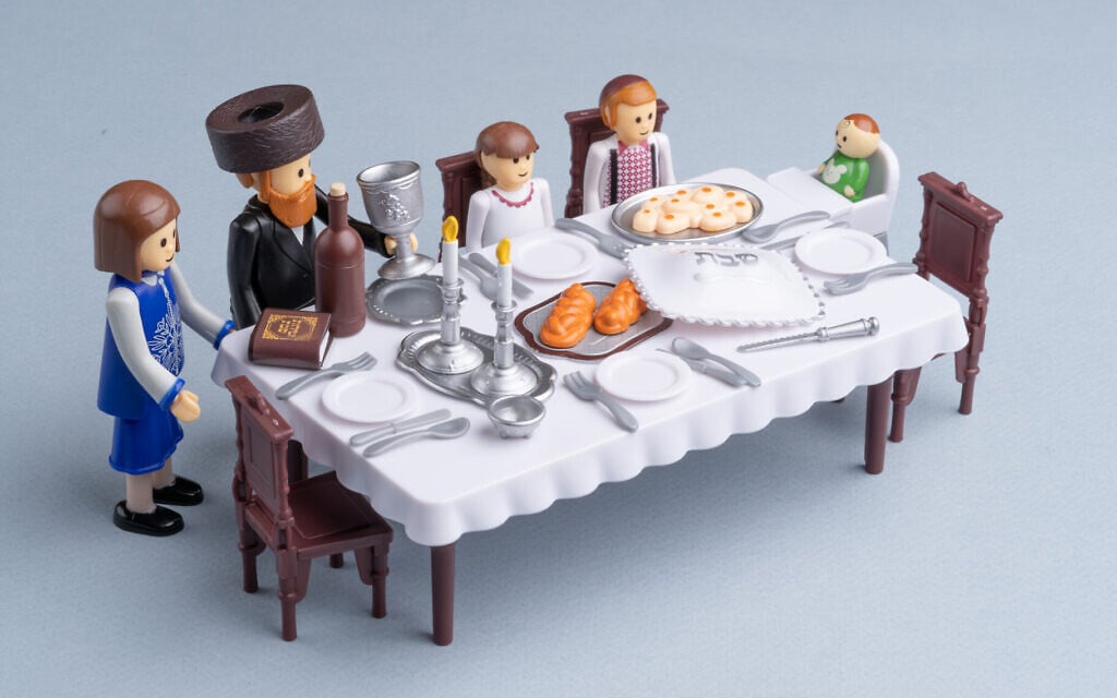 A 'Shabbos Table' set from Kids Play depicts a typical Haredi Orthodox family at home. The designer, Shlomi Eiger, says the brand is part of a 'contemporary trend of Haredi children's toys and games designed from within the community.' (Omar Friedman/ JTA)