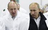 In this Monday, September 20, 2010 file photo, Yevgeny Prigozhin, left, shows Russian President Vladimir Putin, around his factory which produces school meals, outside St. Petersburg, Russia. (Alexei Druzhinin, Sputnik, Kremlin Pool Photo via AP, File)