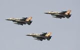 Israeli F-16 fighter jets fly over a beach in Tel Aviv during the annual Independence Day flyover, May 5, 2022. (Jack Guez/AFP)