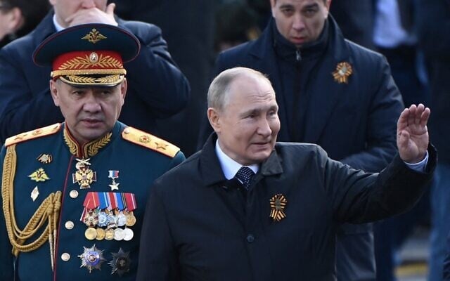 Russian President Vladimir Putin and Defense Minister Sergei Shoigu leave Red Square after the Victory Day military parade in central Moscow on May 9, 2022 (Kirill KUDRYAVTSEV / AFP)