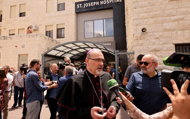 Latin Patriarch of Jerusalem Pierbattista Pizzaballa speaks at Saint Joseph Hospital in Jerusalem on May 16, 2022. (AHMAD GHARABLI / AFP) Latin Patriarch of Jerusalem Pierbattista Pizzaballa speaks at Saint Joseph Hospital in Jerusalem on May 16, 2022. (AHMAD GHARABLI / AFP)