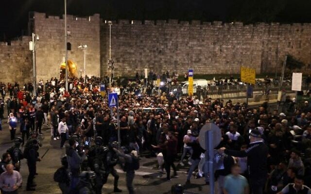 Israeli security forces clash with Palestinians following the funeral of Walid a-Sharif, 23, who died of wounds suffered last month during clashes with Israeli police at Jerusalem's flashpoint al-Aqsa Mosque on the Temple Mount, on May 16, 2022 outside the Old City of Jerusalem. (AHMAD GHARABLI / AFP) Israeli security forces clash with Palestinians following the funeral of Walid a-Sharif, 23, who died of wounds suffered last month during clashes with Israeli police at Jerusalem's flashpoint al-Aqsa Mosque on the Temple Mount, on May 16, 2022 outside the Old City of Jerusalem. (AHMAD GHARABLI / AFP)