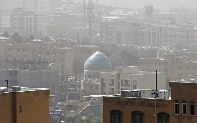 A sandstorm engulfs a mosque in Iran's capital Tehran on May 17, 2022. (AFP)
