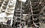 Iranians gather at the site of a 10-story building that collapsed in the southwestern city of Abadan on May 24, 2022. (Tasnim News/AFP)