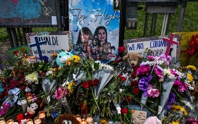 Flowers, candles and pictures are pictured at a makeshift memorial outside the Uvalde County Courthouse in Texas on May 28, 2022. (Chandan Khanna/AFP) Flowers, candles and pictures are pictured at a makeshift memorial outside the Uvalde County Courthouse in Texas on May 28, 2022. (Chandan Khanna/AFP)