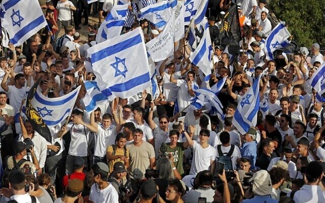 Jews carrying Israeli flags take part in the Flag March outside the Old City of Jerusalem's Damascus Gate on May 29, 2022, as Israel marks Jerusalem Day. (Ahmad Gharabli/AFP) Jews carrying Israeli flags take part in the Flag March outside the Old City of Jerusalem's Damascus Gate on May 29, 2022, as Israel marks Jerusalem Day. (Ahmad Gharabli/AFP)