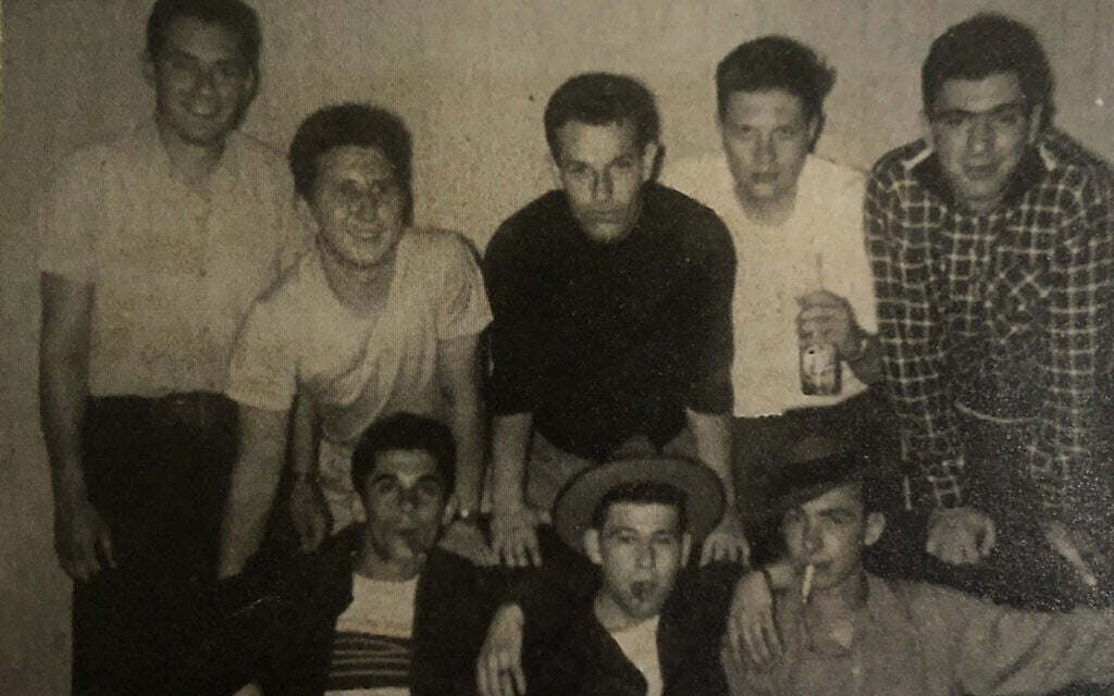 The Warriors in their club house circa 1948. Herbie Cohen in black shirt, hands on knees, center. Larry King, white shirt, at Herbie’s left, holding a bottle. (Courtesy of Rich Cohen)