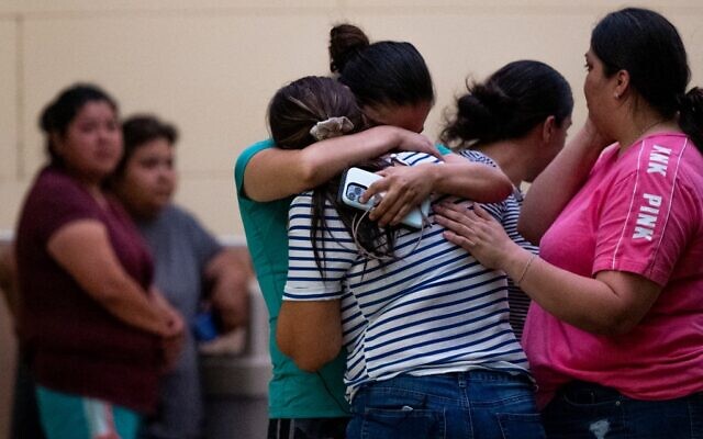People mourn outside of the SSGT Willie de Leon Civic Center following the mass shooting at Robb Elementary School on May 24, 2022 in Uvalde, Texas (Brandon Bell/Getty Images/AFP)