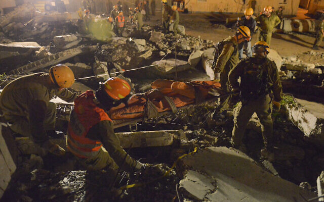 Illustrative: Israeli Home Front Command soldiers take part in a defense drill simulating a building collapse Abu Gosh, November 8, 2015. (Israel Defense Forces) Illustrative: Israeli Home Front Command soldiers take part in a defense drill simulating a building collapse Abu Gosh, November 8, 2015. (Israel Defense Forces)