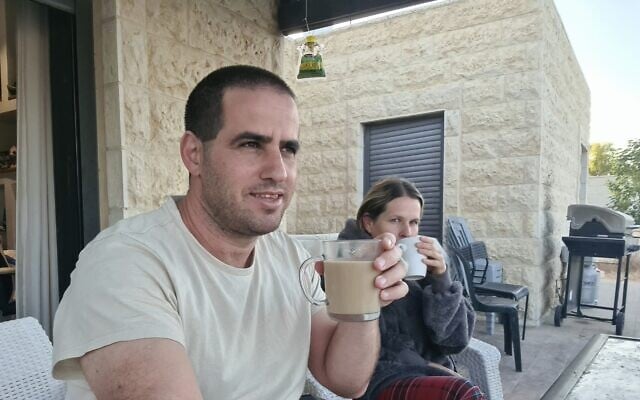 A picture uploaded by Tekoa resident Yair Maimon to Facebook on May 9, shows him and his wife drinking coffee outside their home alongside the caption, 'Waiting for the next terrorist.' (Facebook) A picture uploaded by Tekoa resident Yair Maimon to Facebook on May 9, shows him and his wife drinking coffee outside their home alongside the caption, 'Waiting for the next terrorist.' (Facebook)