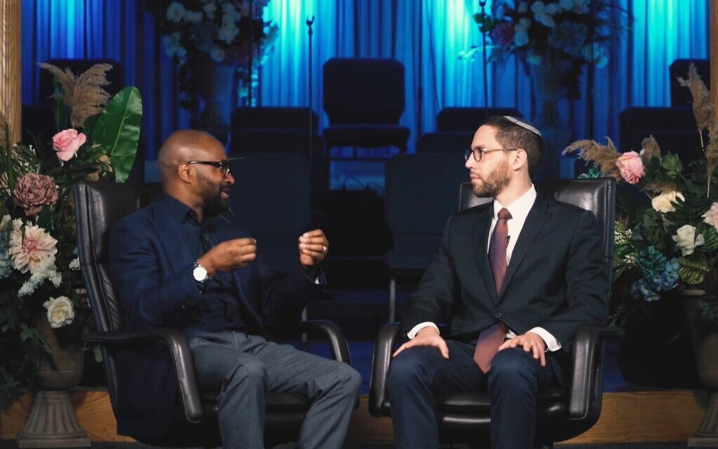 Pastor Chris Harris, who leads two Church of God in Christ congregations in Chicago, and Rabbi Ari Hart of the Orthodox Skokie Valley Agudath Jacob Synagogue teamed up for a shmita debt relief fundraiser. (Screenshot from Facebook via JTA) Pastor Chris Harris, who leads two Church of God in Christ congregations in Chicago, and Rabbi Ari Hart of the Orthodox Skokie Valley Agudath Jacob Synagogue teamed up for a shmita debt relief fundraiser. (Screenshot from Facebook via JTA)