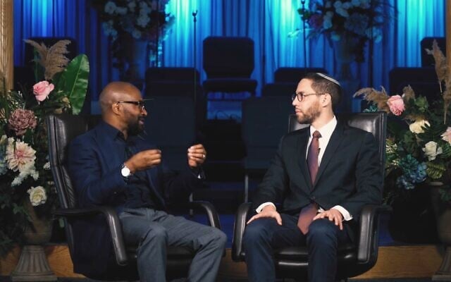 Pastor Chris Harris, who leads two Church of God in Christ congregations in Chicago, and Rabbi Ari Hart of the Orthodox Skokie Valley Agudath Jacob Synagogue teamed up for a shmita debt relief fundraiser. (Screenshot from Facebook via JTA)