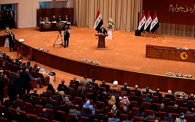 Illustrative: Former Iraqi prime minister Haider al-Abadi, center, addresses a newly elected parliament during its first session in Baghdad, Iraq, September 3, 2018. (AP Photo/Karim Kadim) Illustrative: Former Iraqi prime minister Haider al-Abadi, center, addresses a newly elected parliament during its first session in Baghdad, Iraq, September 3, 2018. (AP Photo/Karim Kadim)