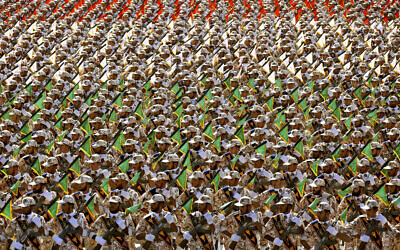 In this September 22, 2014, photo, members of the Iran's Revolutionary Guard march during an annual military parade at the mausoleum of ayatollah Khomeini, outside Tehran, Iran (AP Photo/Ebrahim Noroozi, File)