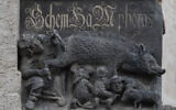 The so-called "Judensau," or "Jew pig," sculpture is displayed on the facade of the town church in Wittenberg, Germany (AP Photo/Jens Meyer, File)