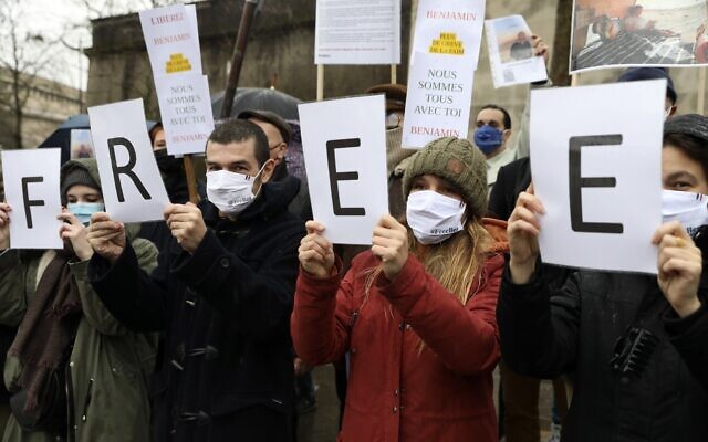 People hold placards during a rally in Paris for French citizen Benjamin Briere, a tourist who has been jailed in Iran for nearly two years, January 8, 2022. (AP Photo/Adrienne Surprenant) People hold placards during a rally in Paris for French citizen Benjamin Briere, a tourist who has been jailed in Iran for nearly two years, January 8, 2022. (AP Photo/Adrienne Surprenant)