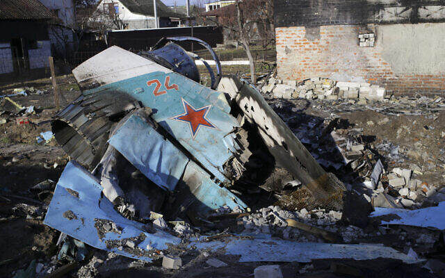 Fragments of a Russian jet fighter on a private house in Chernihiv, Ukraine, Wednesday, April 6, 2022. (AP Photo/Stas Yurchenko) Fragments of a Russian jet fighter on a private house in Chernihiv, Ukraine, Wednesday, April 6, 2022. (AP Photo/Stas Yurchenko)