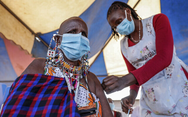 Illustrative image: a woman receives a coronavirus vaccine in Kimana, southern Kenya on Aug. 28, 2021. While vaccines have been rolled out in Africa, boosters are lacking there, as in many other parts of the world. (AP Photo/Brian Inganga, File) Illustrative image: a woman receives a coronavirus vaccine in Kimana, southern Kenya on Aug. 28, 2021. While vaccines have been rolled out in Africa, boosters are lacking there, as in many other parts of the world. (AP Photo/Brian Inganga, File)