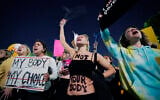 A crowd of people gather outside the Supreme Court, on May 3, 2022 in Washington. (AP Photo/Alex Brandon)