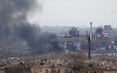 In this photo taken from video, smoke rises from the Metallurgical Combine Azovstal in Mariupol, in territory under the government of the Donetsk People's Republic, eastern Ukraine, on May 3, 2022. (AP Photo)