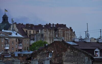Two women, lower right, look out a window after a Russian missile strike in Lviv, Ukraine, on May 3, 2022. Russian missile strikes targeted the city in western Ukraine, hitting electrical substations and disrupting power. (AP Photo/Jon Gambrell) Two women, lower right, look out a window after a Russian missile strike in Lviv, Ukraine, on May 3, 2022. Russian missile strikes targeted the city in western Ukraine, hitting electrical substations and disrupting power. (AP Photo/Jon Gambrell)