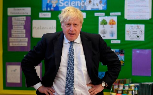 Britain's Prime Minister Boris Johnson visits the Field End Infant school, in South Ruislip, London, on May 6, 2022, following the local government elections. (Daniel Leal/Pool via AP) Britain's Prime Minister Boris Johnson visits the Field End Infant school, in South Ruislip, London, on May 6, 2022, following the local government elections. (Daniel Leal/Pool via AP)