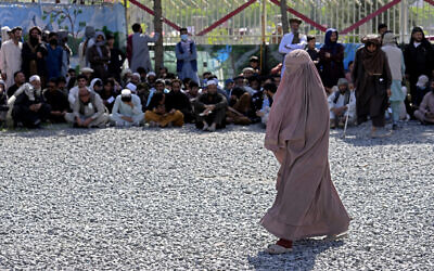 An Afghan woman waits to receives food rations distributed by a Saudi humanitarian aid group, in Kabul, Afghanistan, on Monday, April 25, 2022. (AP Photo/Ebrahim Noroozi) An Afghan woman waits to receives food rations distributed by a Saudi humanitarian aid group, in Kabul, Afghanistan, on Monday, April 25, 2022. (AP Photo/Ebrahim Noroozi)