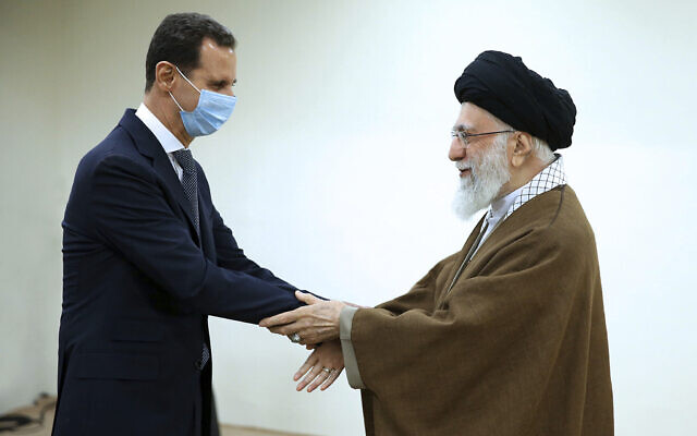 In this picture released by the official website of the office of the Iranian supreme leader, Supreme Leader Ayatollah Ali Khamenei, right, and Syrian President Bashar Assad shake hands at the start of their meeting, in Tehran, Iran, May 8, 2022. (Office of the Iranian Supreme Leader via AP) In this picture released by the official website of the office of the Iranian supreme leader, Supreme Leader Ayatollah Ali Khamenei, right, and Syrian President Bashar Assad shake hands at the start of their meeting, in Tehran, Iran, May 8, 2022. (Office of the Iranian Supreme Leader via AP)