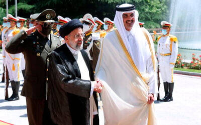 File: In this photo released by the official website of the office of the Iranian Presidency, Qatari Emir Sheikh Tamim bin Hamad Al Thani, right, shakes hands with President Ebrahim Raisi during an official arrival ceremony at the Saadabad Palace in Tehran, Iran, on May 12, 2022. (Iranian Presidency Office via AP) File: In this photo released by the official website of the office of the Iranian Presidency, Qatari Emir Sheikh Tamim bin Hamad Al Thani, right, shakes hands with President Ebrahim Raisi during an official arrival ceremony at the Saadabad Palace in Tehran, Iran, on May 12, 2022. (Iranian Presidency Office via AP)