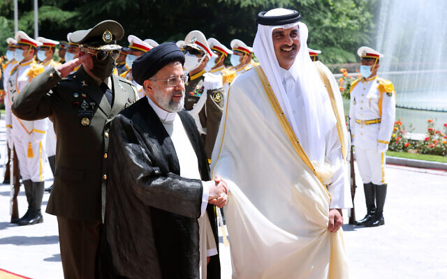 File: In this photo released by the official website of the office of the Iranian Presidency, Qatari Emir Sheikh Tamim bin Hamad Al Thani, right, shakes hands with President Ebrahim Raisi during an official arrival ceremony at the Saadabad Palace in Tehran, Iran, on May 12, 2022. (Iranian Presidency Office via AP) File: In this photo released by the official website of the office of the Iranian Presidency, Qatari Emir Sheikh Tamim bin Hamad Al Thani, right, shakes hands with President Ebrahim Raisi during an official arrival ceremony at the Saadabad Palace in Tehran, Iran, on May 12, 2022. (Iranian Presidency Office via AP)
