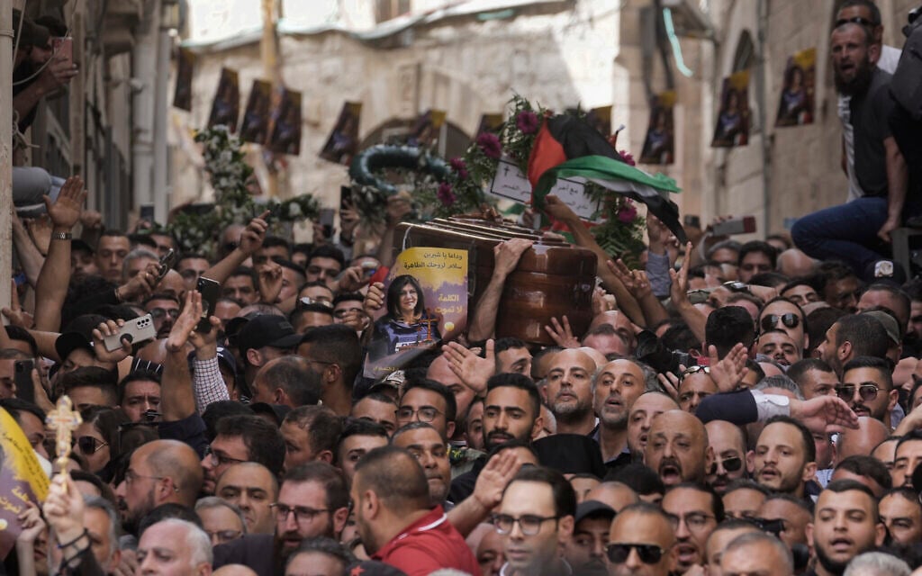 Mourners carry the casket of slain Al Jazeera veteran journalist Shireen Abu Akleh during her funeral in Jerusalem's Old City, May 13, 2022. (AP Photo/Mahmoud Illean) Mourners carry the casket of slain Al Jazeera veteran journalist Shireen Abu Akleh during her funeral in Jerusalem's Old City, May 13, 2022. (AP Photo/Mahmoud Illean)