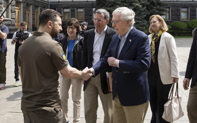 In this handout photo provided by the Ukrainian Presidential Press Office, Ukrainian President Volodymyr Zelensky, left, shakes hands with US Senate Minority Leader Mitch McConnell in Kyiv, Ukraine, May 14, 2022. (Ukrainian Presidential Press Office via AP) In this handout photo provided by the Ukrainian Presidential Press Office, Ukrainian President Volodymyr Zelensky, left, shakes hands with US Senate Minority Leader Mitch McConnell in Kyiv, Ukraine, May 14, 2022. (Ukrainian Presidential Press Office via AP)