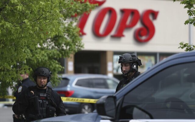 Police secure a perimeter after a shooting at a supermarket, Saturday, May 14, 2022, in Buffalo, NY (AP Photo/Joshua Bessex) Police secure a perimeter after a shooting at a supermarket, Saturday, May 14, 2022, in Buffalo, NY (AP Photo/Joshua Bessex)