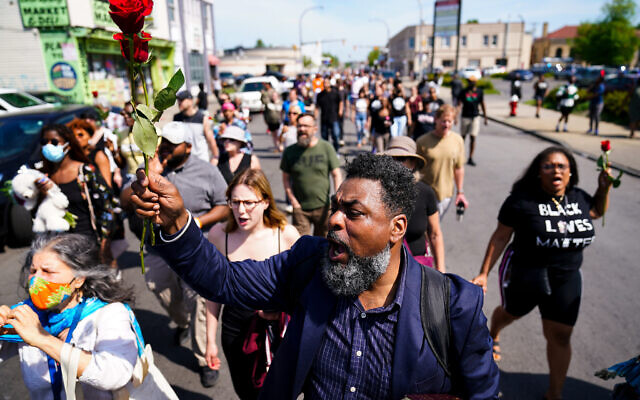 People march to the scene of a shooting at a supermarket in Buffalo, N.Y., Sunday, May 15, 2022. (AP Photo/Matt Rourke) People march to the scene of a shooting at a supermarket in Buffalo, N.Y., Sunday, May 15, 2022. (AP Photo/Matt Rourke)